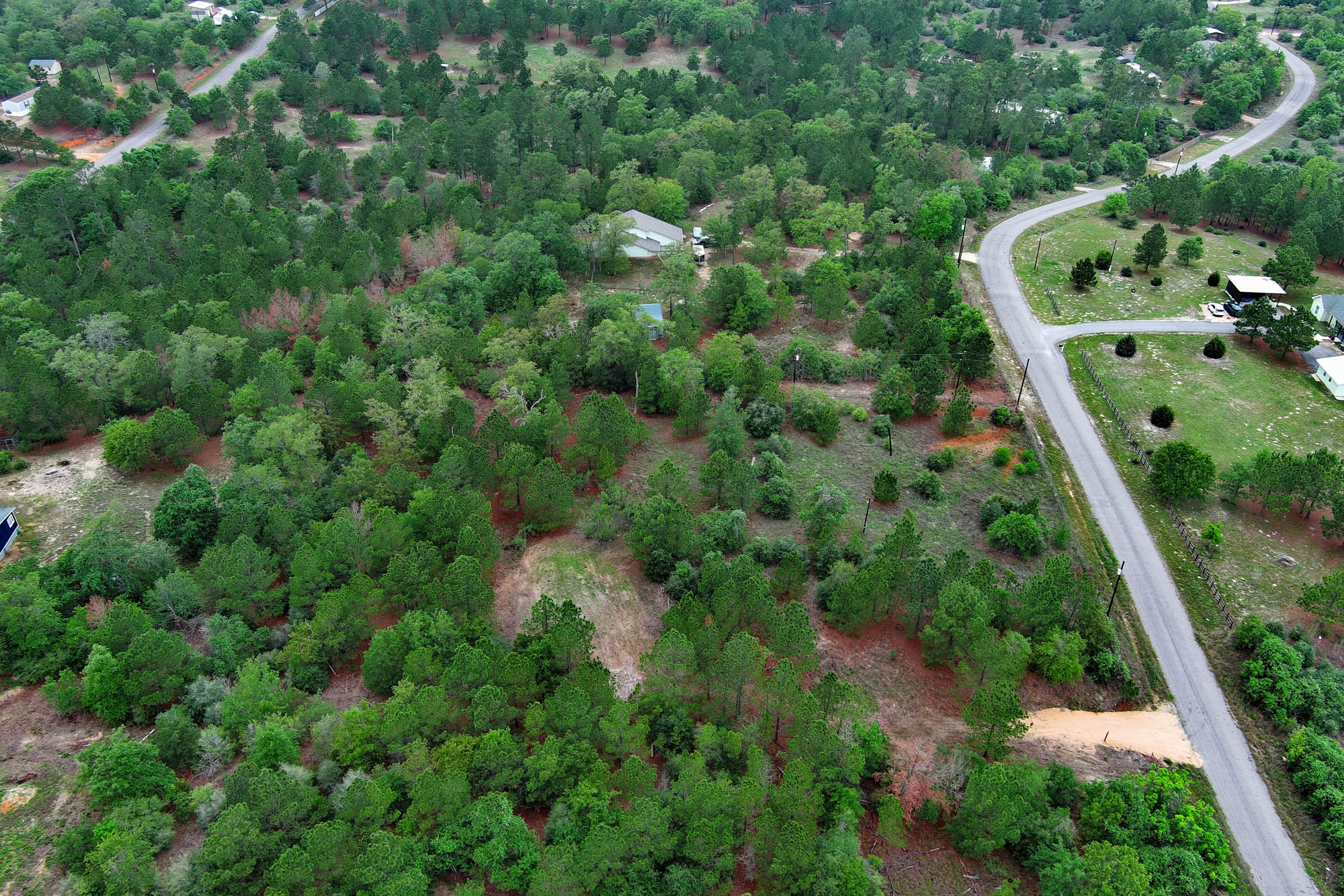 172 Kelley Road East Bastrop, TX 78602 - Photo 9 of 26 an aerial view of residential houses with outdoor space and trees
