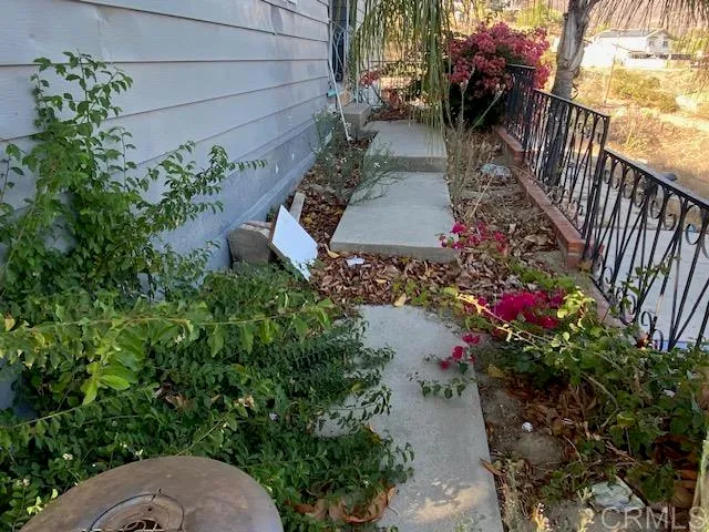 a view of a backyard with sitting area