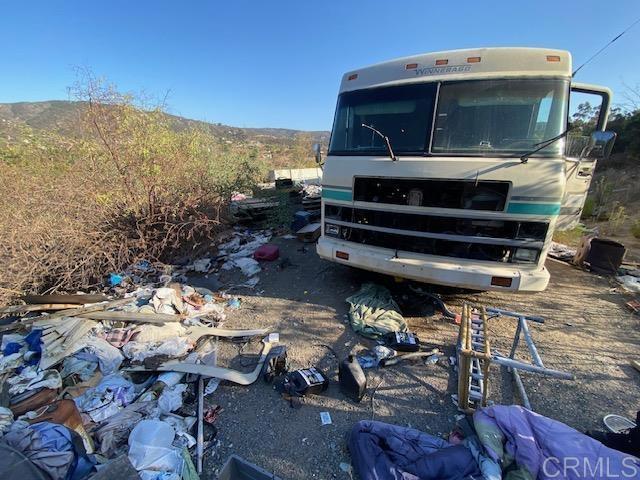 5676 Dehesa Road El Cajon, CA 92019 - Photo 19 of 23 a view of a chairs and table in the patio