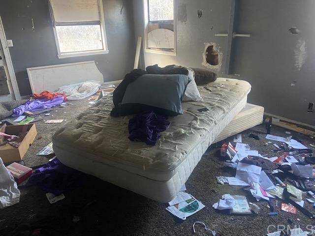 5676 Dehesa Road El Cajon, CA 92019 - Photo 5 of 23 a bedroom with a bed and a window