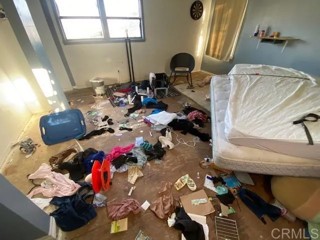 a view of a workspace with furniture and floor to ceiling window