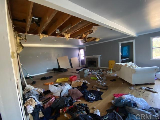 5676 Dehesa Road El Cajon, CA 92019 - Photo 10 of 23 a gym room with gym equipment and a flat screen tv