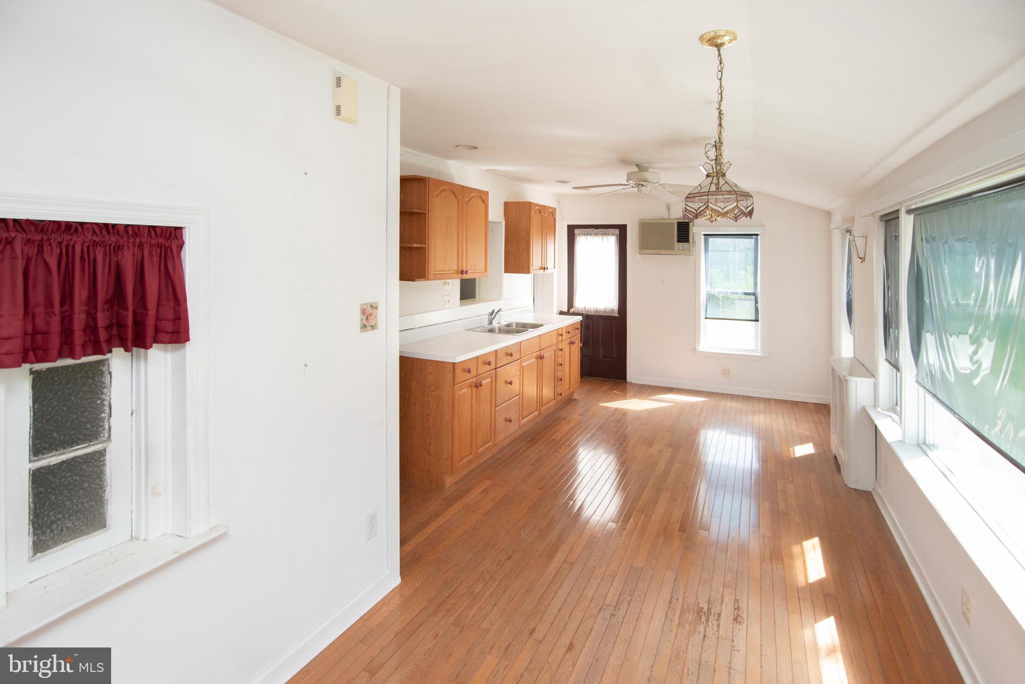 800 Forrest Street Lansdale, PA 19446 - Photo 11 of 42 a view of a kitchen with wooden floor and windows