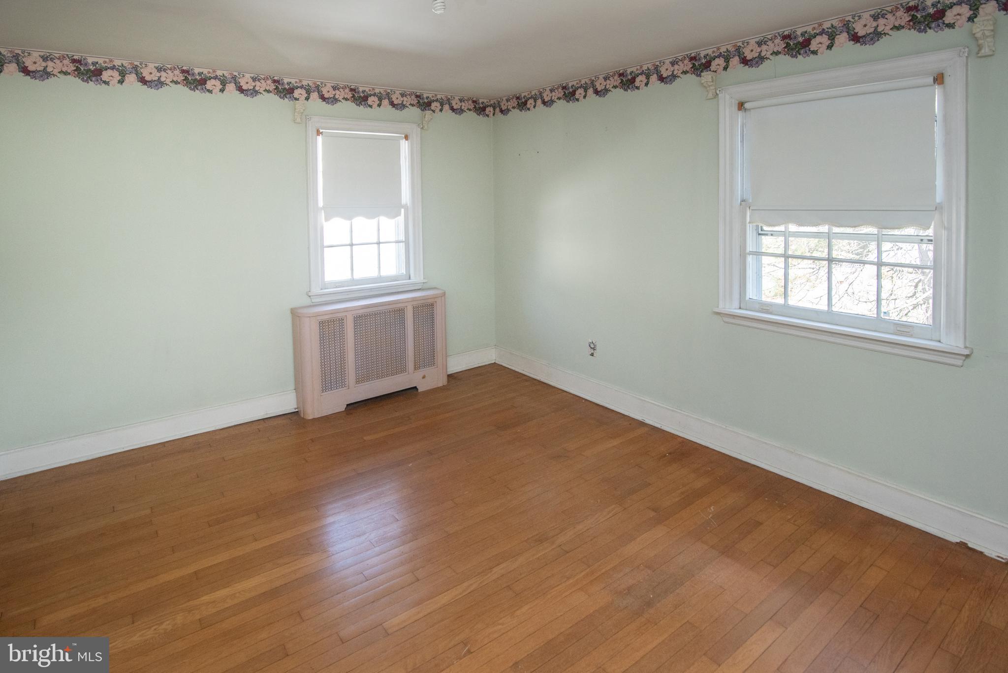 800 Forrest Street Lansdale, PA 19446 - Photo 31 of 42 an empty room with wooden floor and windows