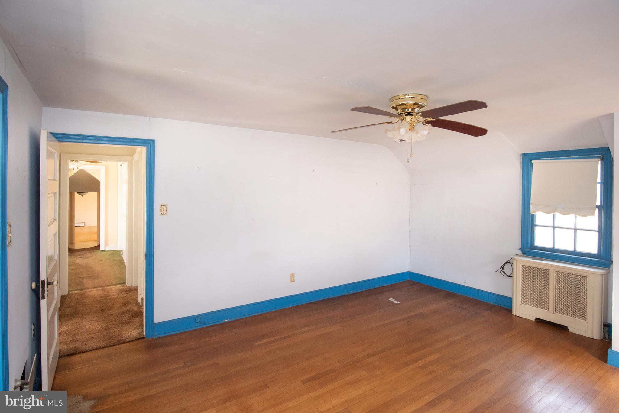 800 Forrest Street Lansdale, PA 19446 - Photo 35 of 42 a view of a room with wooden floor and a ceiling fan