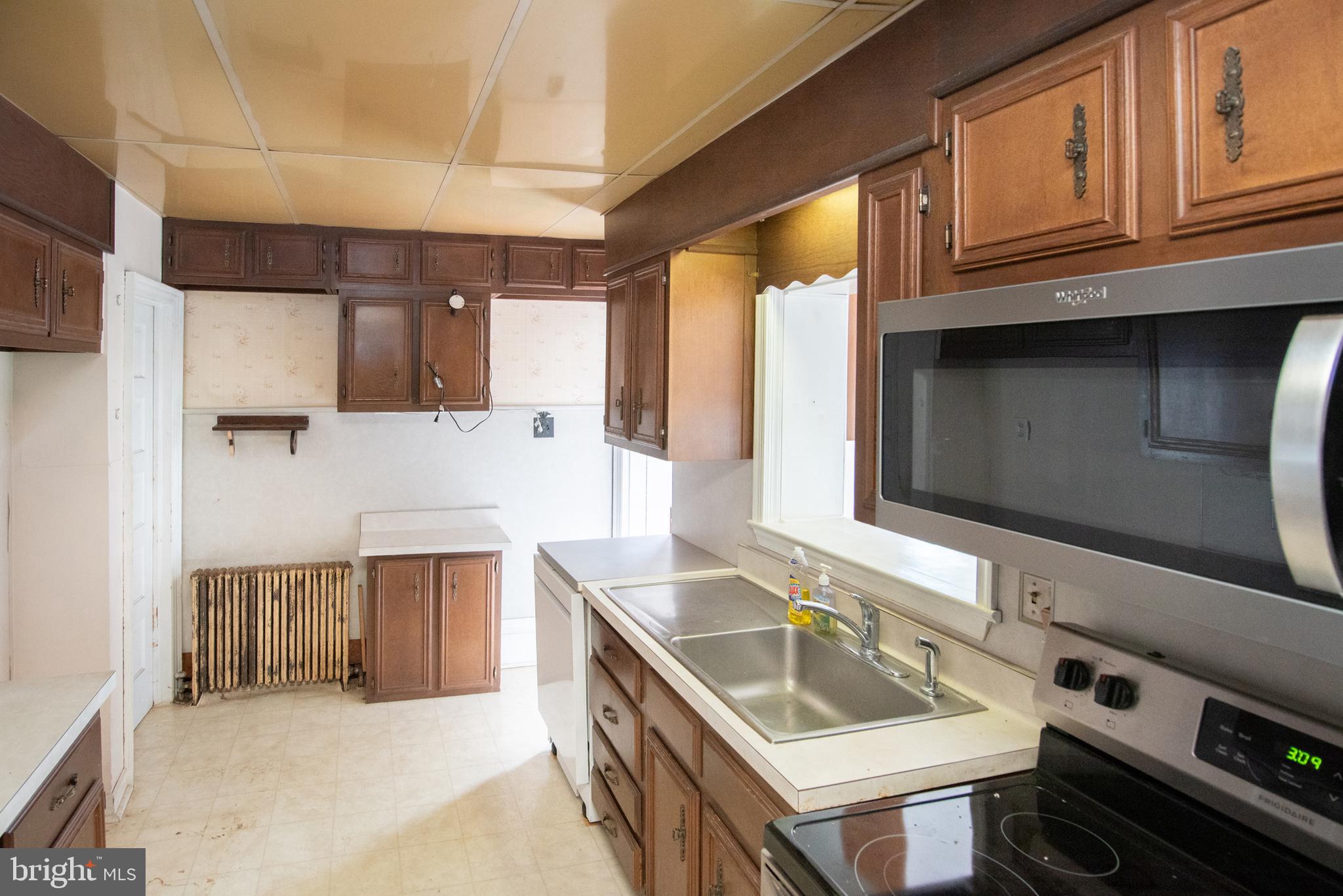 800 Forrest Street Lansdale, PA 19446 - Photo 8 of 42 a kitchen with stainless steel appliances granite countertop a sink and a stove