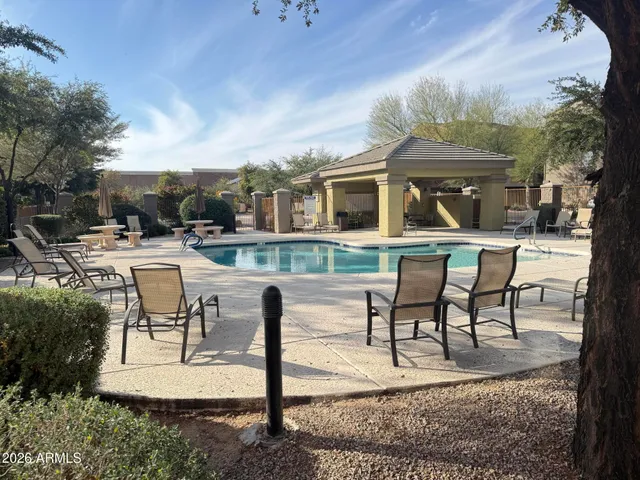 a view of a brick house with a yard