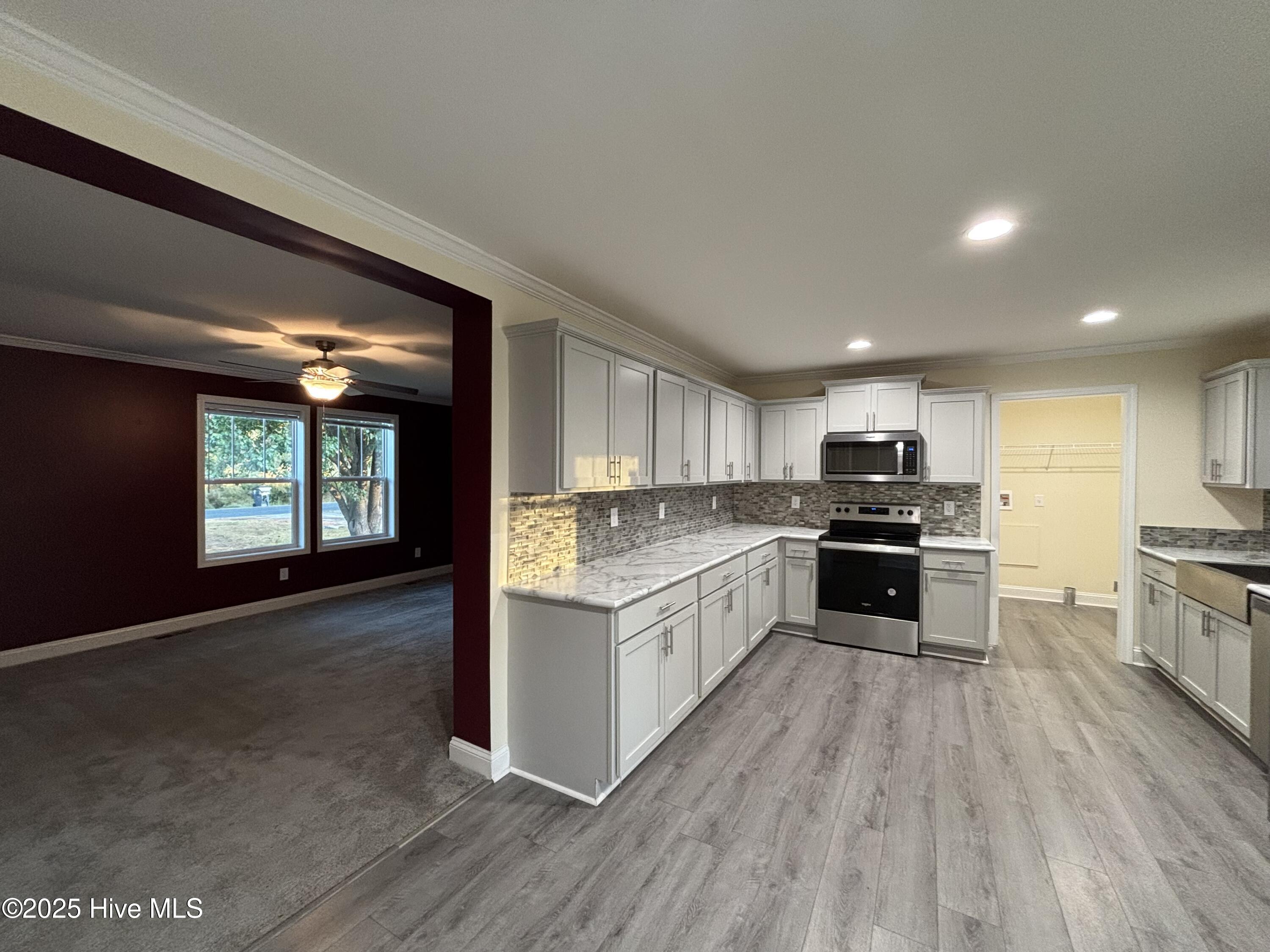 64 High Orchard Road Whiteville, NC 28472 - Photo 20 of 33 Living room has a nice privacy/divide from kitchen.