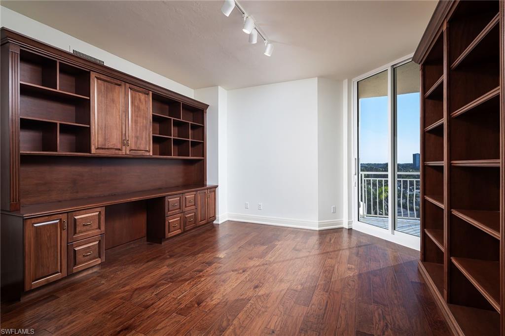 435 Dockside Drive, Unit B703 Naples, FL 34110 - Photo 21 of 38 a view of kitchen with furniture and wooden floor