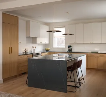 a kitchen with a sink cabinets and window