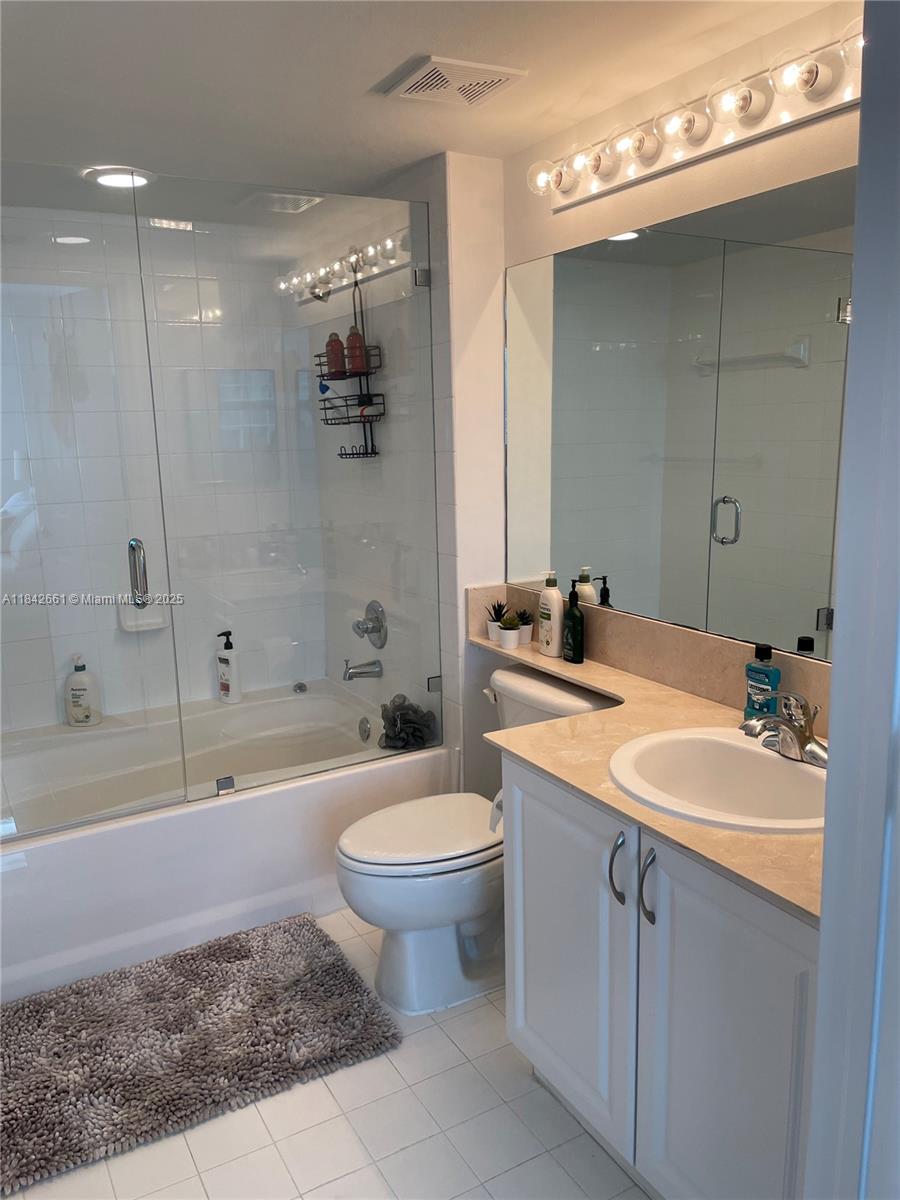 1155 Brickell Bay Drive, Unit 2802 Miami, FL 33131 - Photo 18 of 43 a bathroom with a sink a toilet and shower