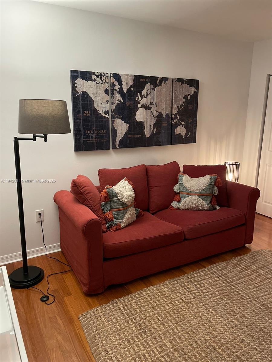 1155 Brickell Bay Drive, Unit 2802 Miami, FL 33131 - Photo 31 of 43 a living room with a couch and a coffee table