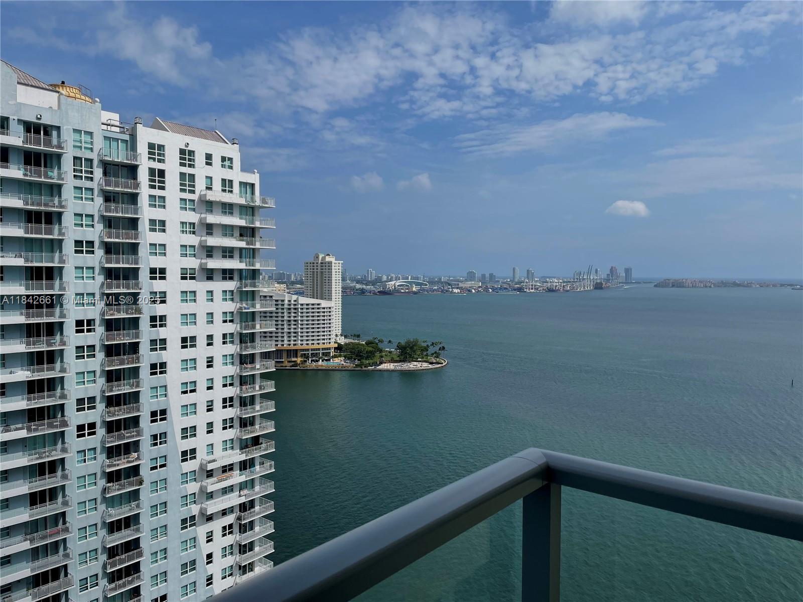 1155 Brickell Bay Drive, Unit 2802 Miami, FL 33131 - Photo 35 of 43 a view of balcony with city and lake view