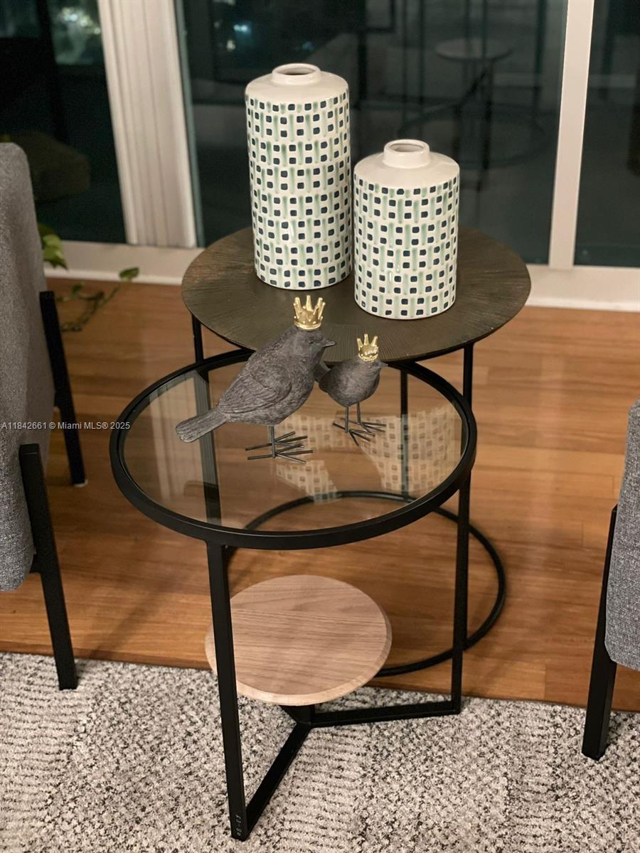 1155 Brickell Bay Drive, Unit 2802 Miami, FL 33131 - Photo 6 of 43 a table and chairs in a room