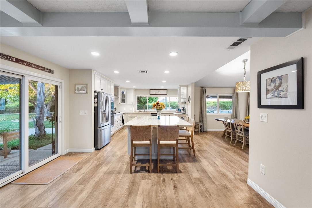 26440 Old Agency Road Hemet, CA 92544 - Photo 17 of 74 a view of a dining room with furniture window and wooden floor