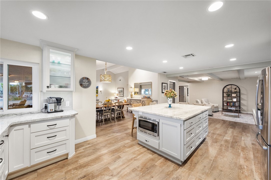 26440 Old Agency Road Hemet, CA 92544 - Photo 20 of 74 a kitchen with a stove and cabinets