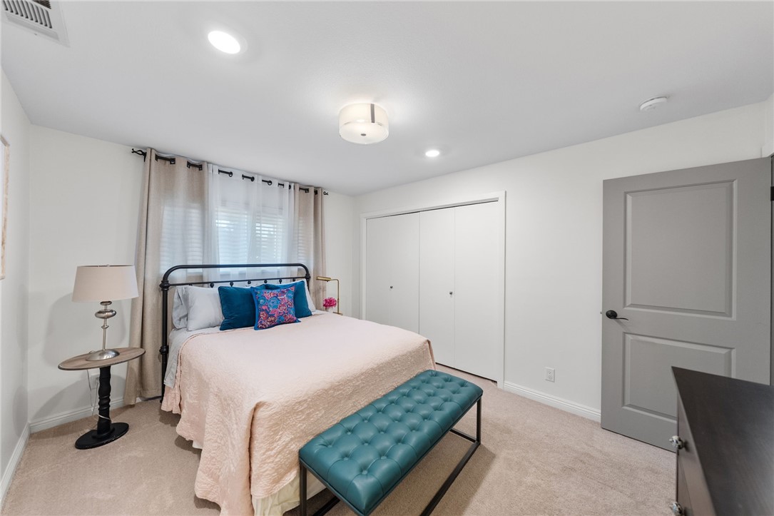 26440 Old Agency Road Hemet, CA 92544 - Photo 43 of 74 a bedroom with a bed and a night stand