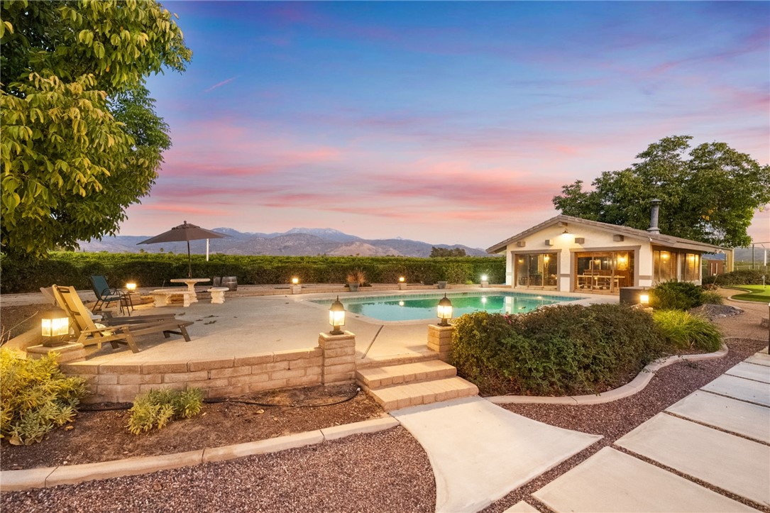 26440 Old Agency Road Hemet, CA 92544 - Photo 56 of 74 a view of a lake with a house in the background