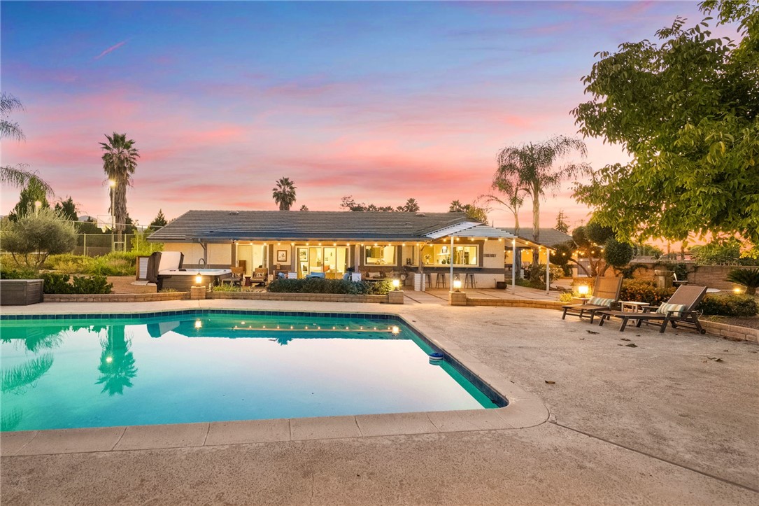 26440 Old Agency Road Hemet, CA 92544 - Photo 60 of 74 a view of swimming pool with outdoor seating and a yard