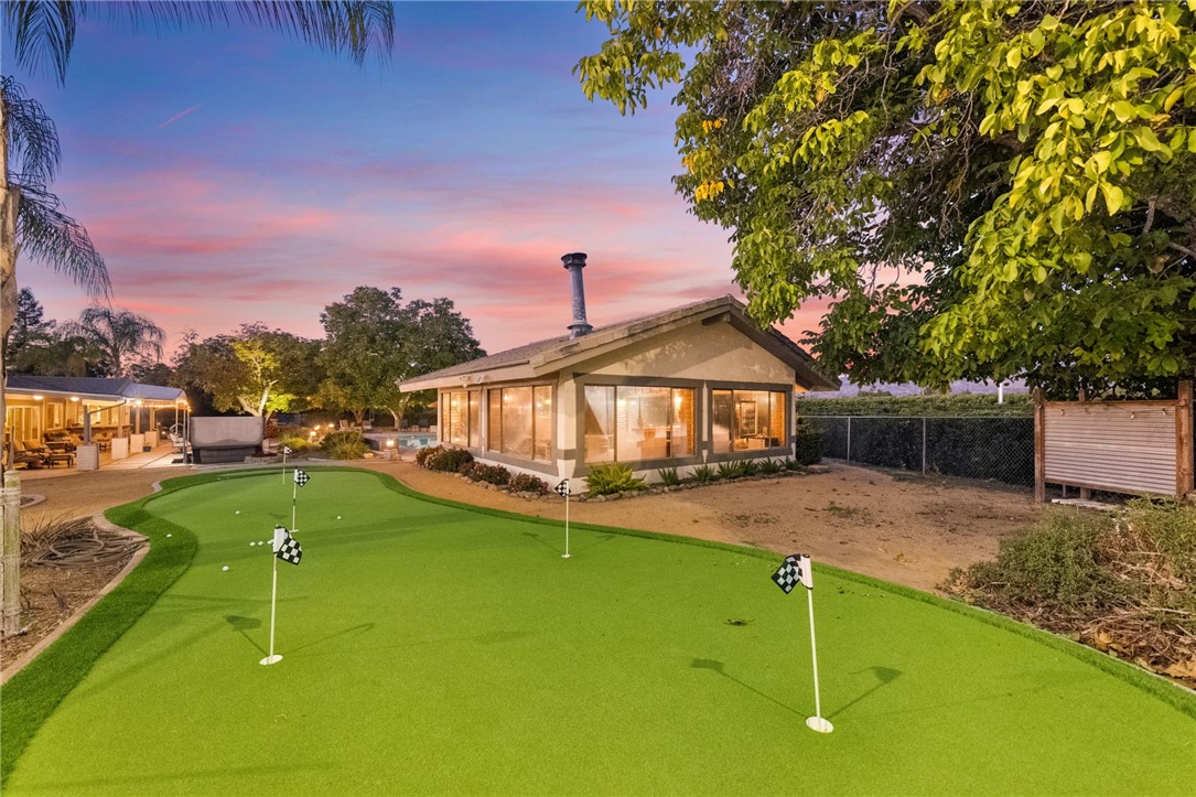 26440 Old Agency Road Hemet, CA 92544 - Photo 67 of 74 a view of a house with a yard porch and sitting area