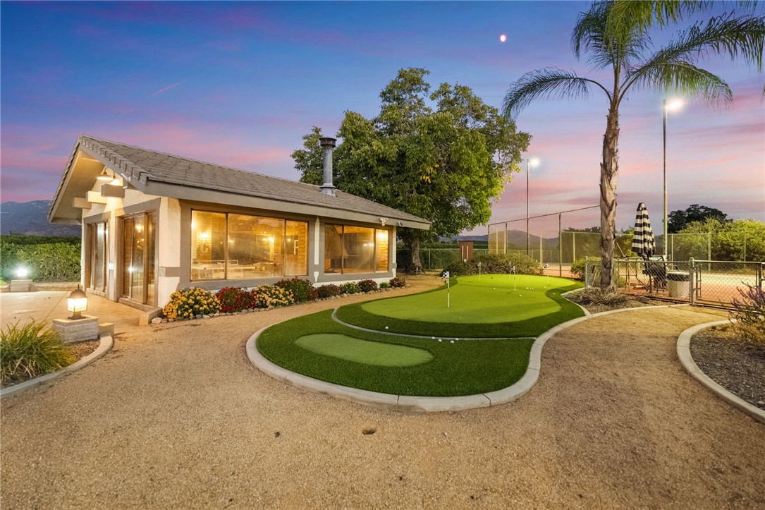 26440 Old Agency Road Hemet, CA 92544 - Photo 68 of 74 a view of a swimming pool with a garden