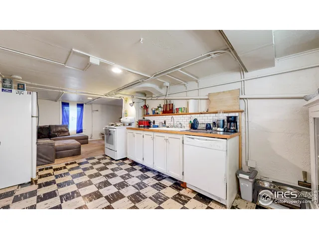 a living room with a bed furniture and a window