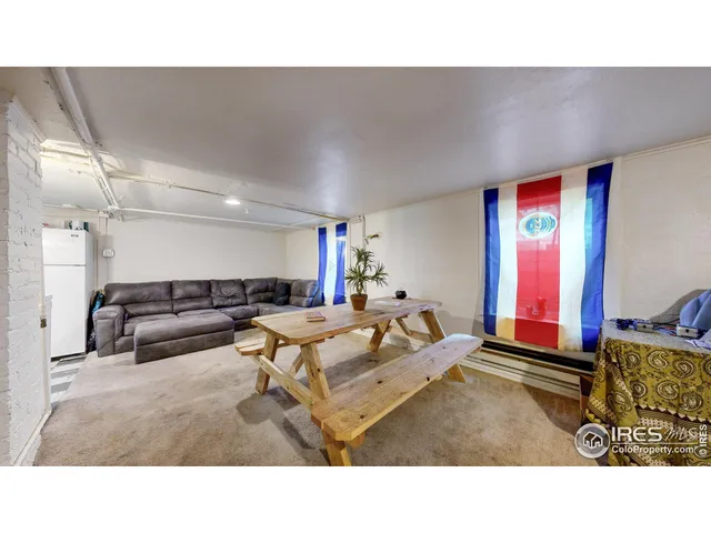 a living room with a couch and a flat screen tv