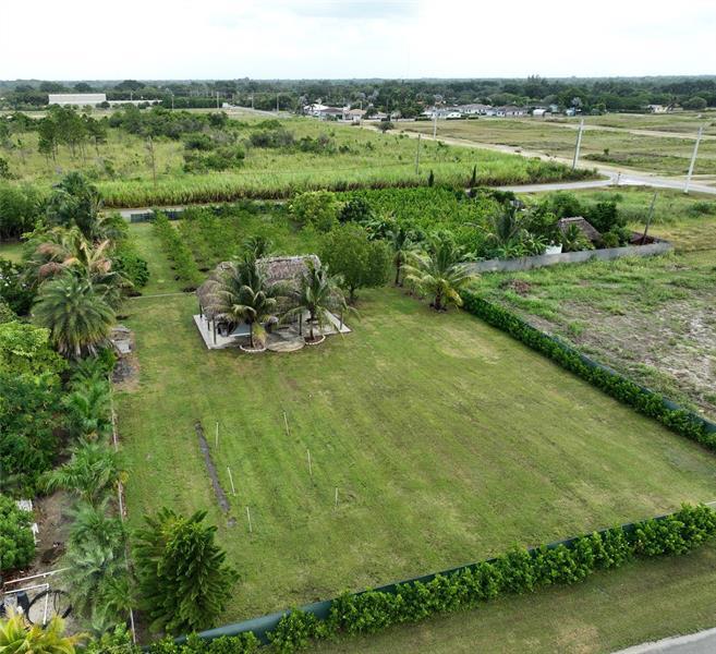 19741 Southwest 325th Street Homestead, FL 33030 - Photo 2 of 7 a view of a green field with clear sky