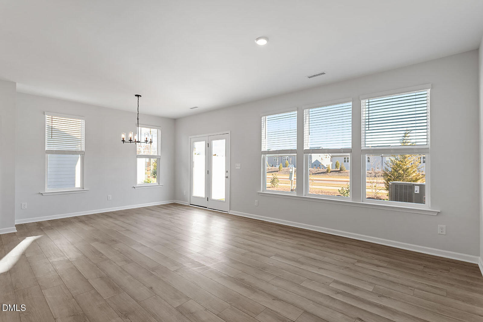 931 Westerland Way, Unit 74 Durham, NC 27703 - Photo 13 of 33 a view of an empty room with wooden floor and a window