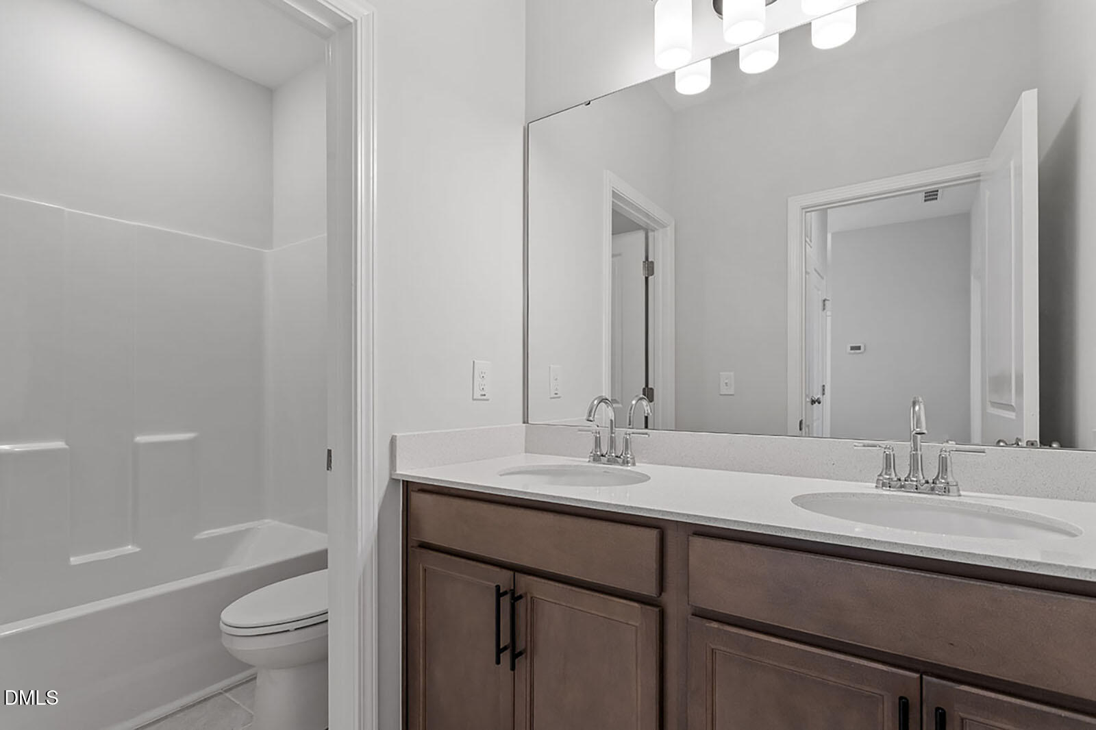 931 Westerland Way, Unit 74 Durham, NC 27703 - Photo 24 of 33 a bathroom with a granite countertop sink a toilet and a large mirror