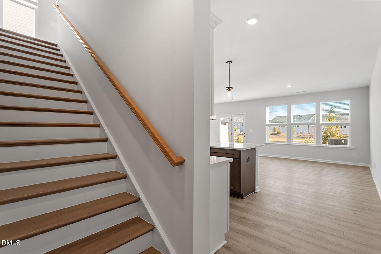 931 Westerland Way, Unit 74 Durham, NC 27703 - Photo 3 of 33 a view of a hallway with wooden floor and staircase