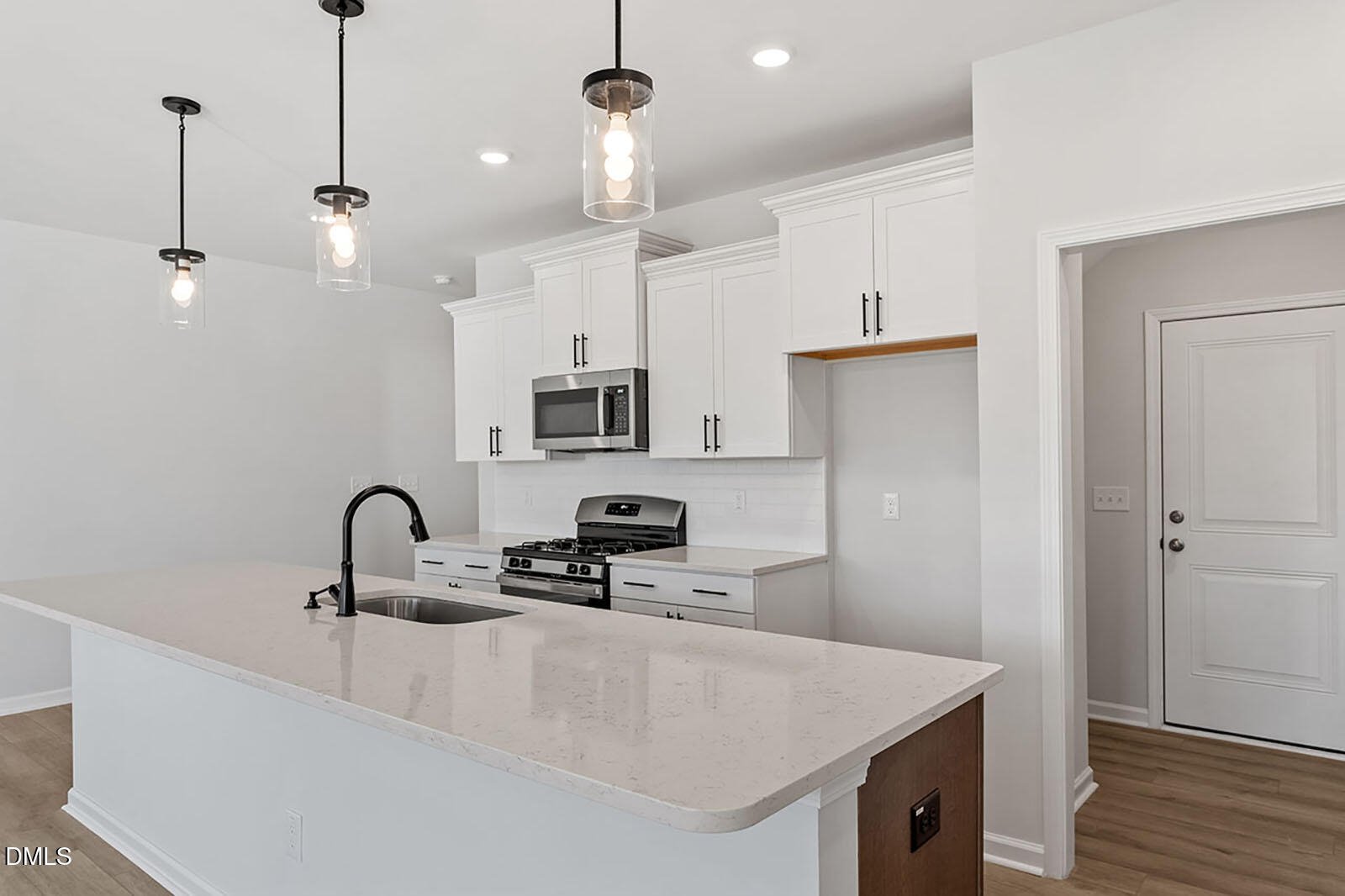 931 Westerland Way, Unit 74 Durham, NC 27703 - Photo 6 of 33 a kitchen with sink a refrigerator and microwave