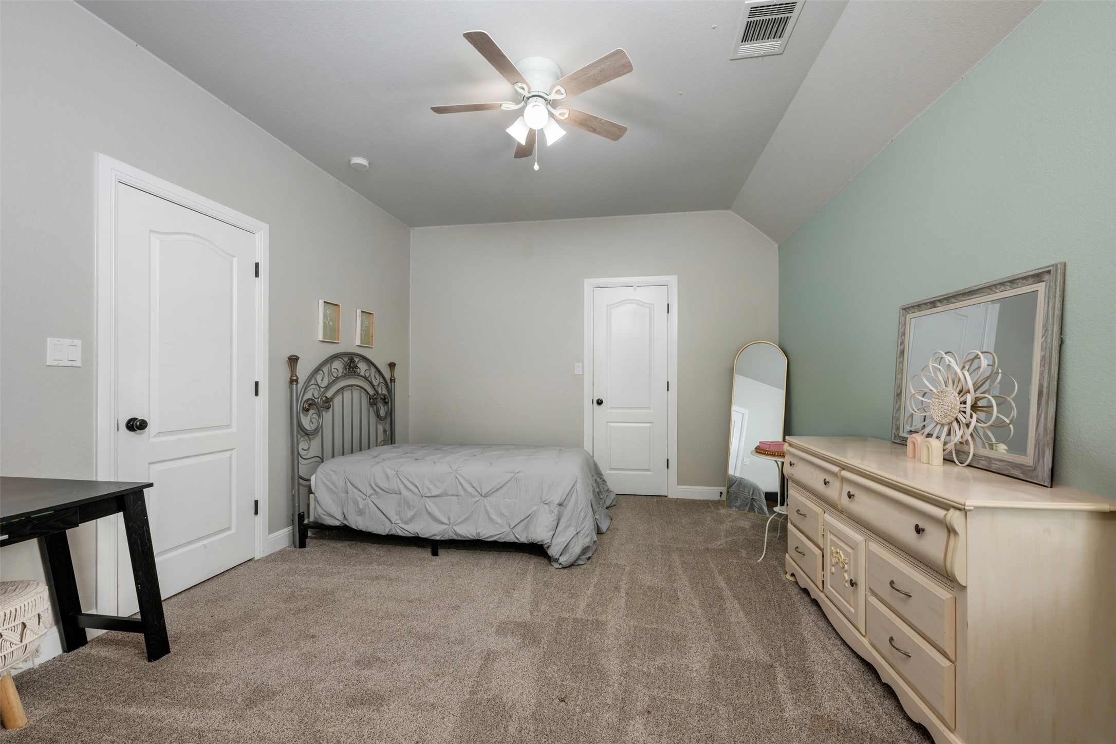 3021 Wedgescale Pass Leander, TX 78641 - Photo 22 of 40 a room with a bed and a chandelier