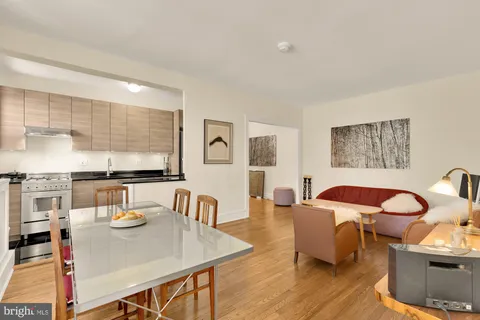 a view of a dining room with furniture and wooden floor