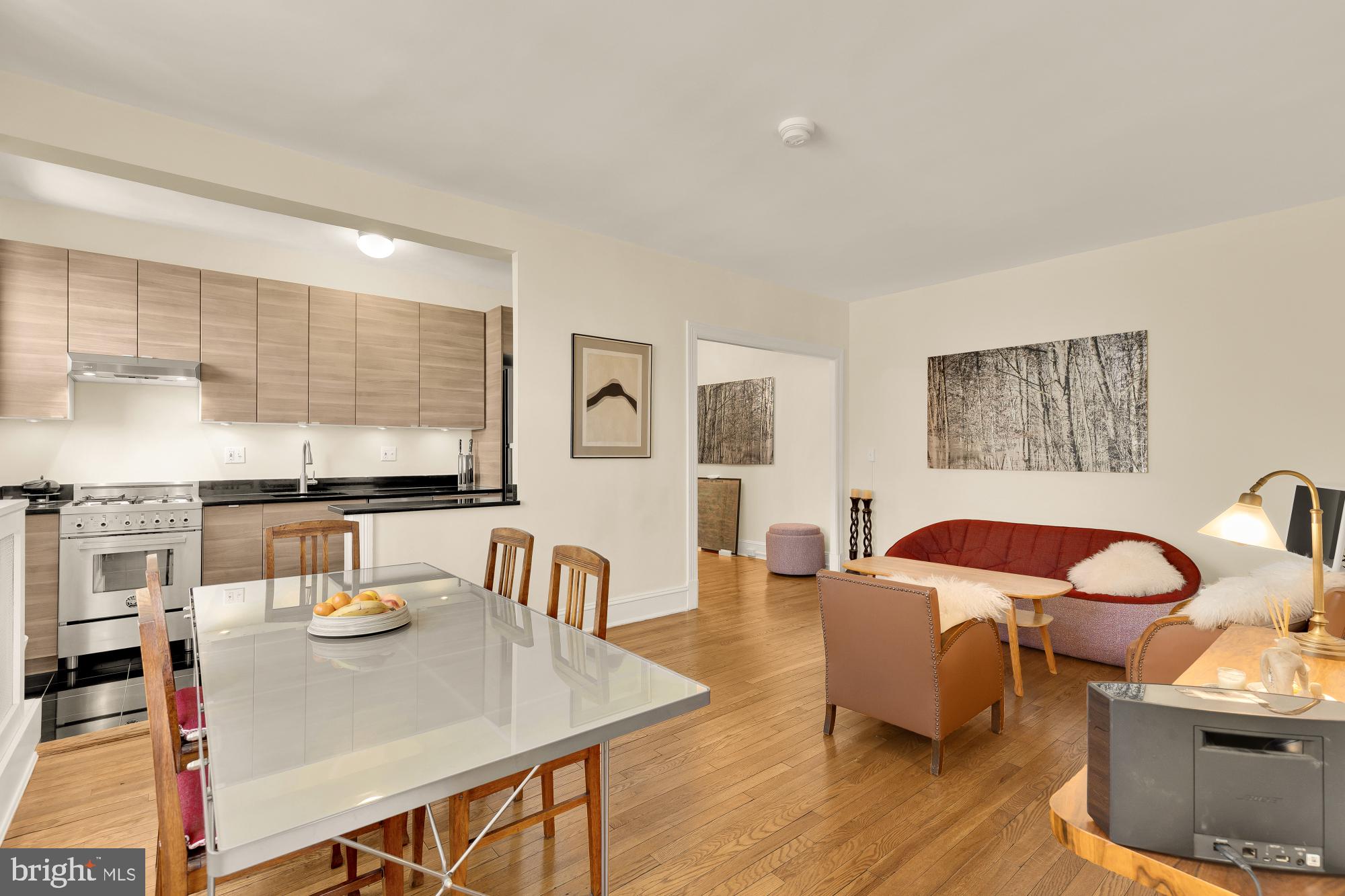1901 Columbia Road Northwest, Unit 601 Washington, DC 20009 - Photo 1 of 15 a view of a dining room with furniture and wooden floor