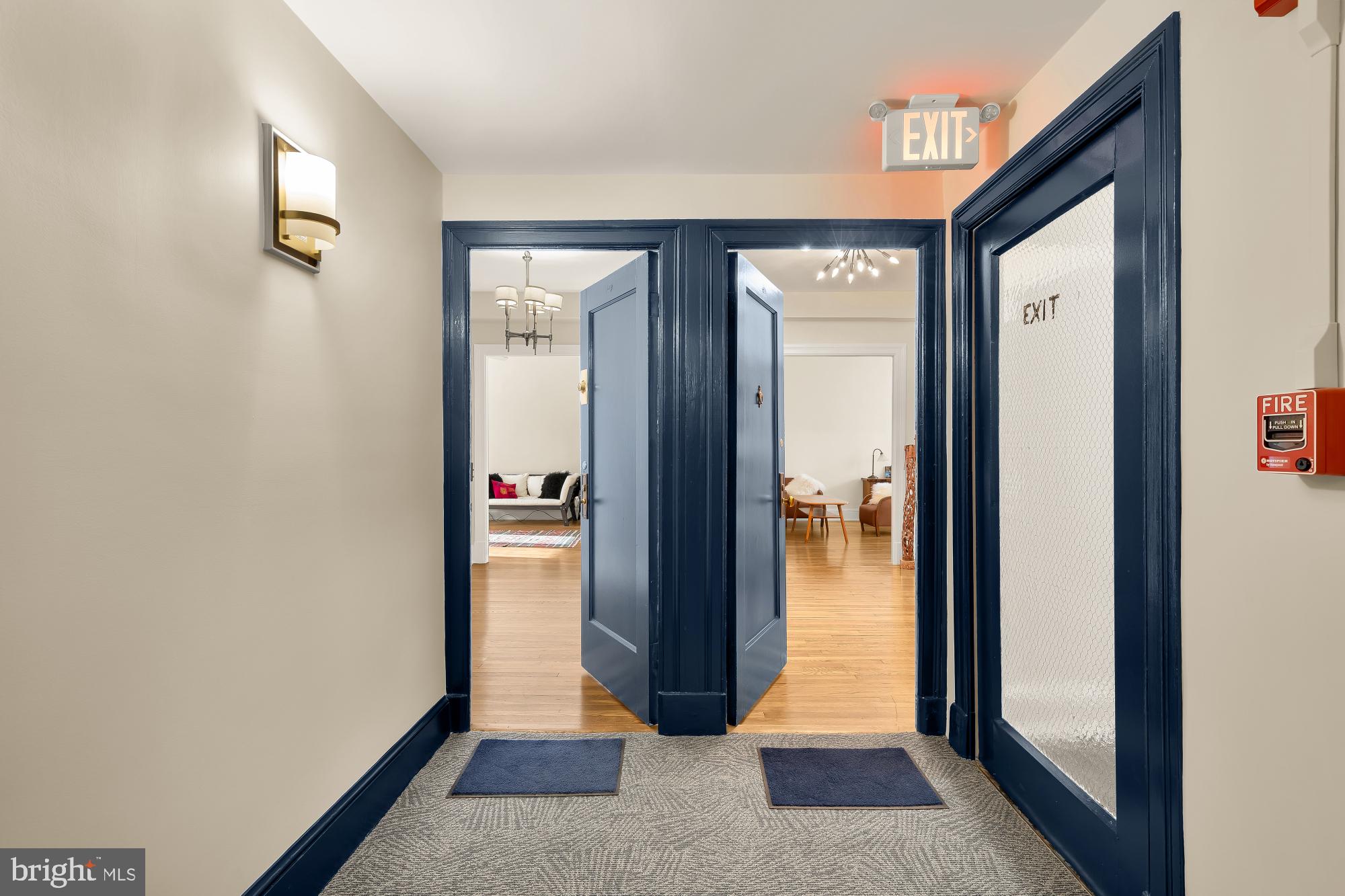 1901 Columbia Road Northwest, Unit 601 Washington, DC 20009 - Photo 4 of 15 a view of a hallway with wooden floor and closet