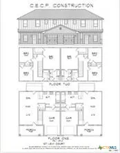 a black and white photo of a black building