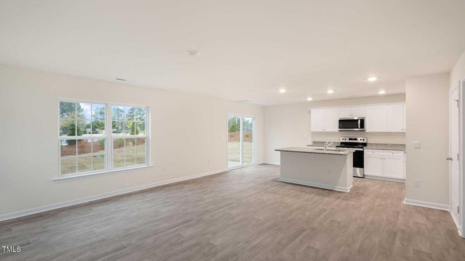6029 Sodium Street Raleigh, NC 27610 - Photo 13 of 25 a view of kitchen with kitchen island sink stainless steel appliances and cabinets