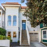 front view of a house with a small yard
