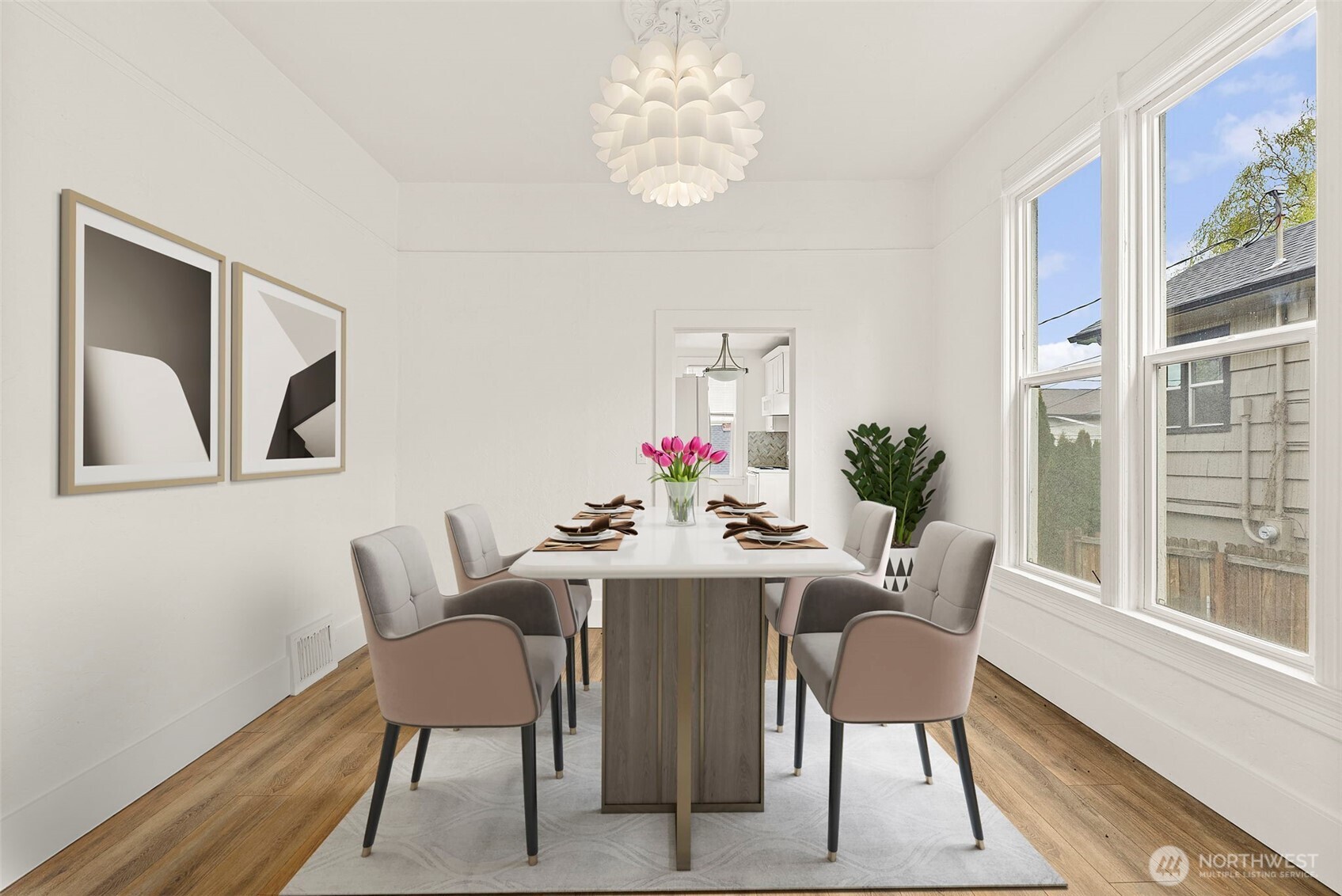 409 South 30th Street Tacoma, WA 98402 - Photo 11 of 37 a dining room with furniture potted plants and wooden floor