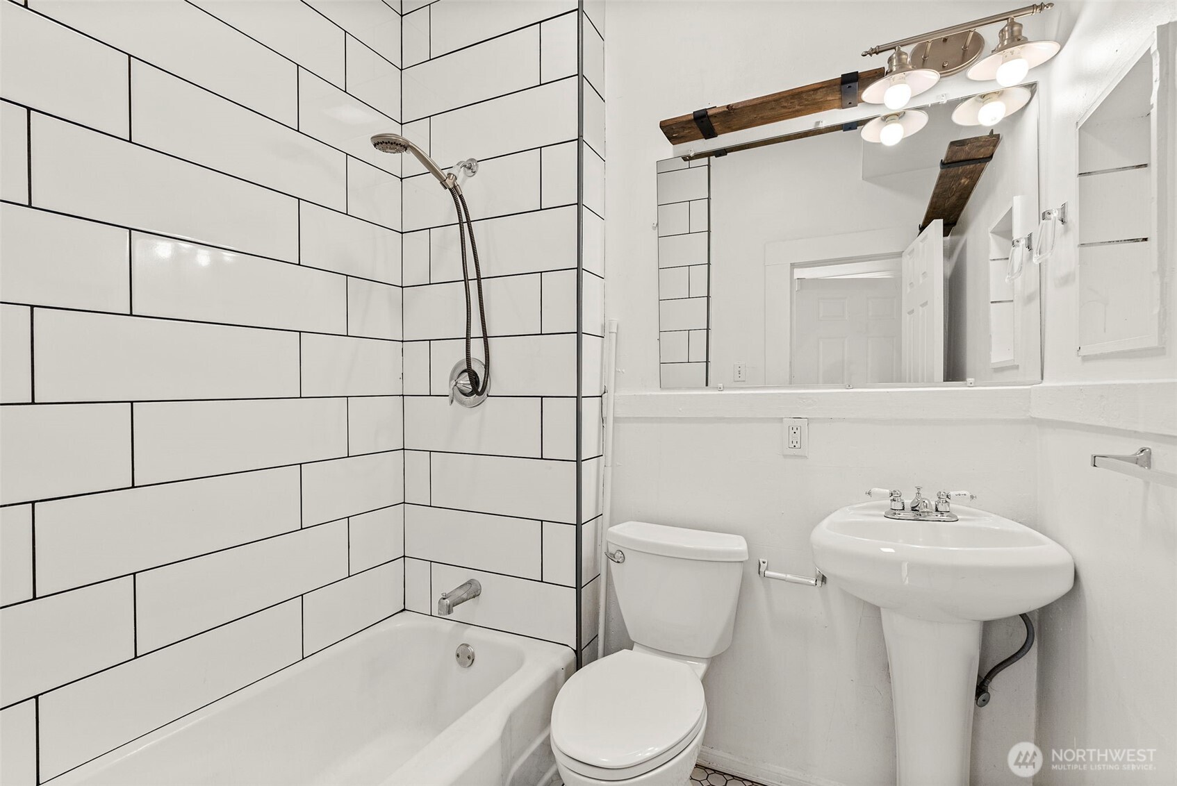 409 South 30th Street Tacoma, WA 98402 - Photo 17 of 37 a bathroom with a sink toilet and shower