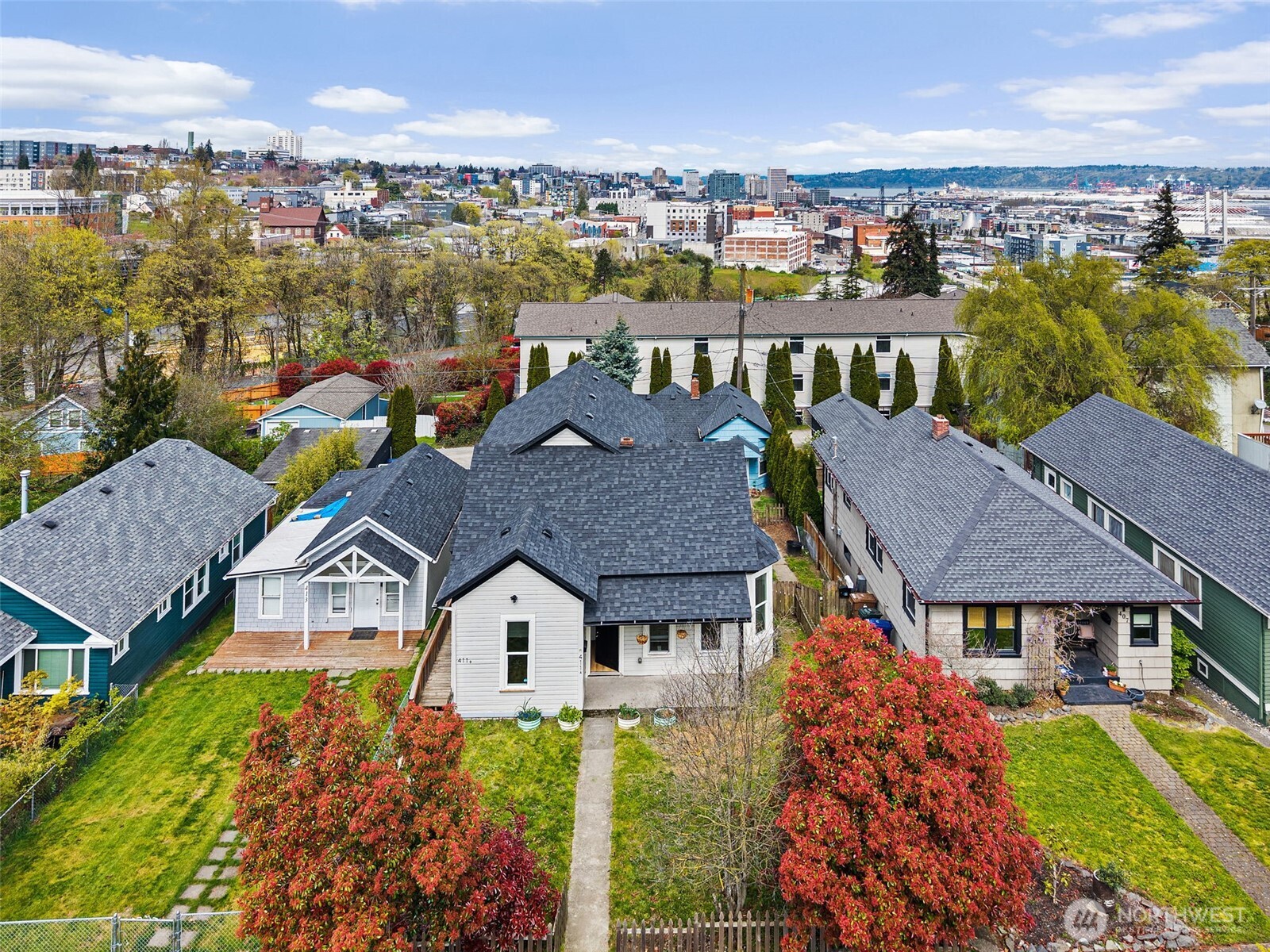 409 South 30th Street Tacoma, WA 98402 - Photo 2 of 37 an aerial view of multiple houses with a yard