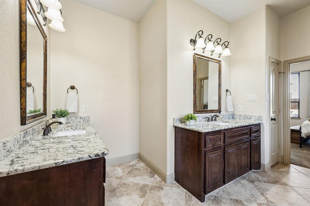 1341 Canary Lane Forney, TX 75126 - Photo 16 of 34 Primary bathroom with separate vanities
