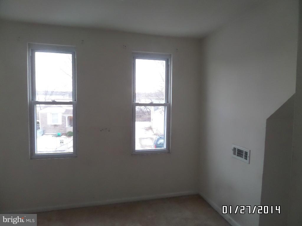 166 Riverside Road Baltimore, MD 21221 - Photo 14 of 16 a view of an empty room with a window