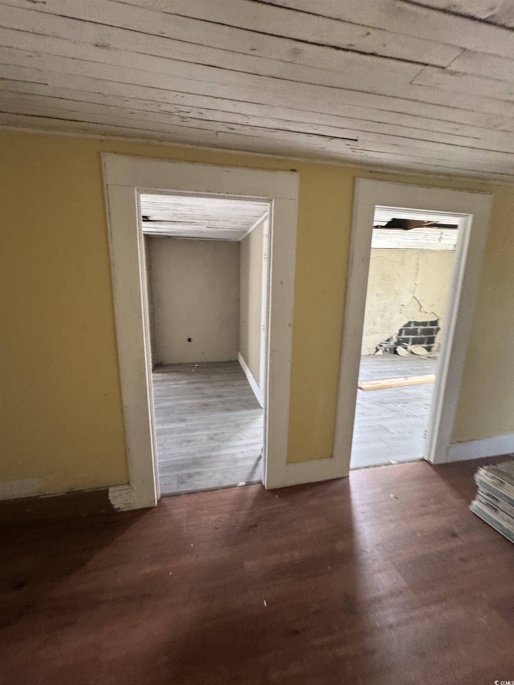 4211 Meeting Street Loris, SC 29569 - Photo 11 of 22 Hall with dark wood-style flooring and baseboards