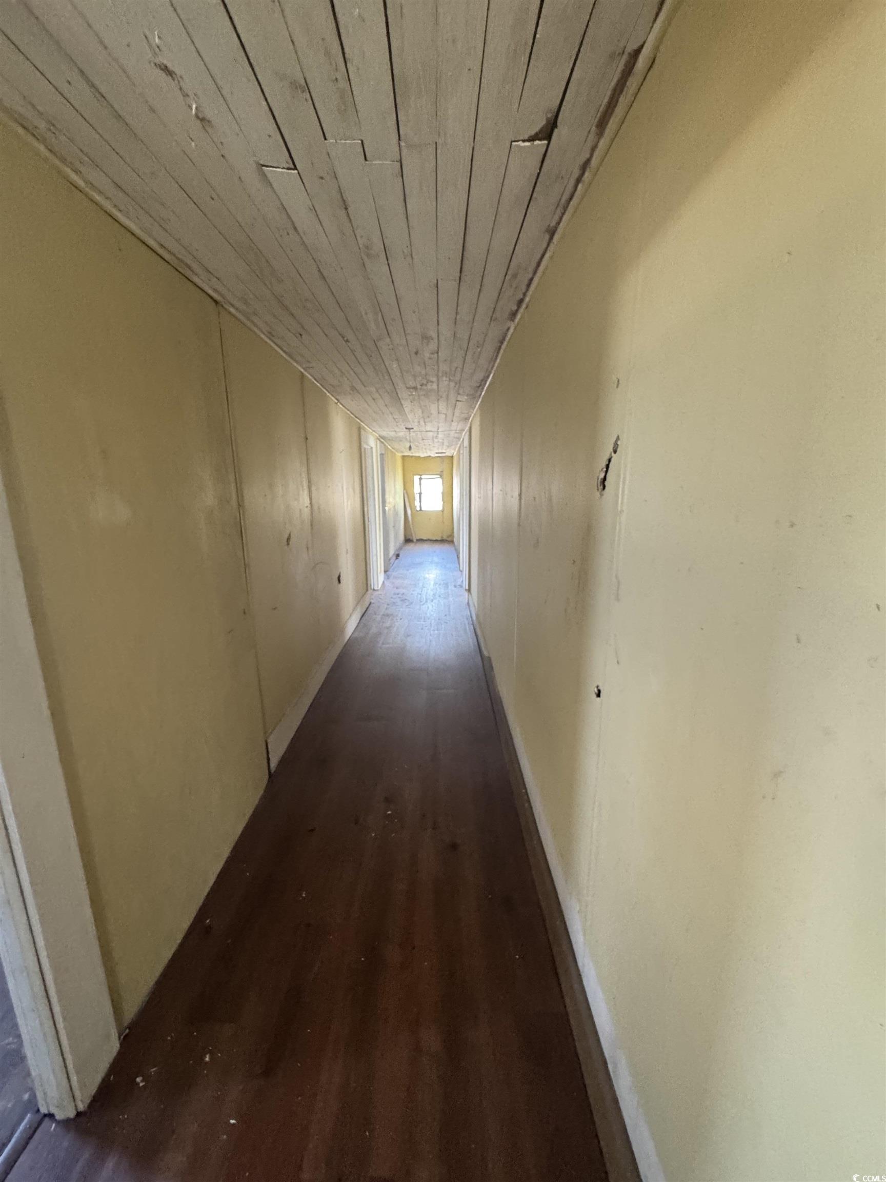 4211 Meeting Street Loris, SC 29569 - Photo 16 of 22 Hall featuring dark wood finished floors and wooden ceiling