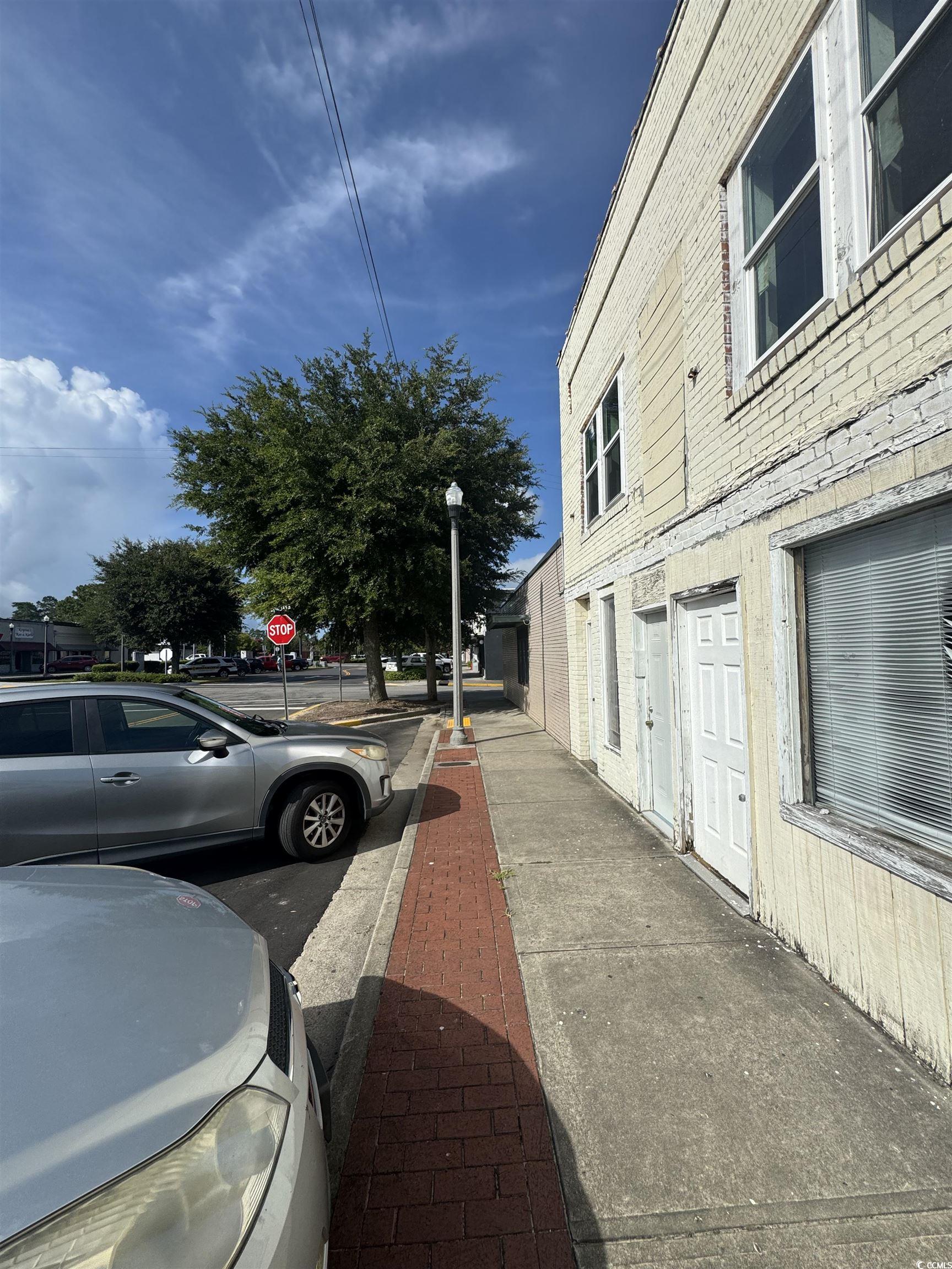 4211 Meeting Street Loris, SC 29569 - Photo 20 of 22 View of street featuring sidewalks, traffic signs, and street lighting