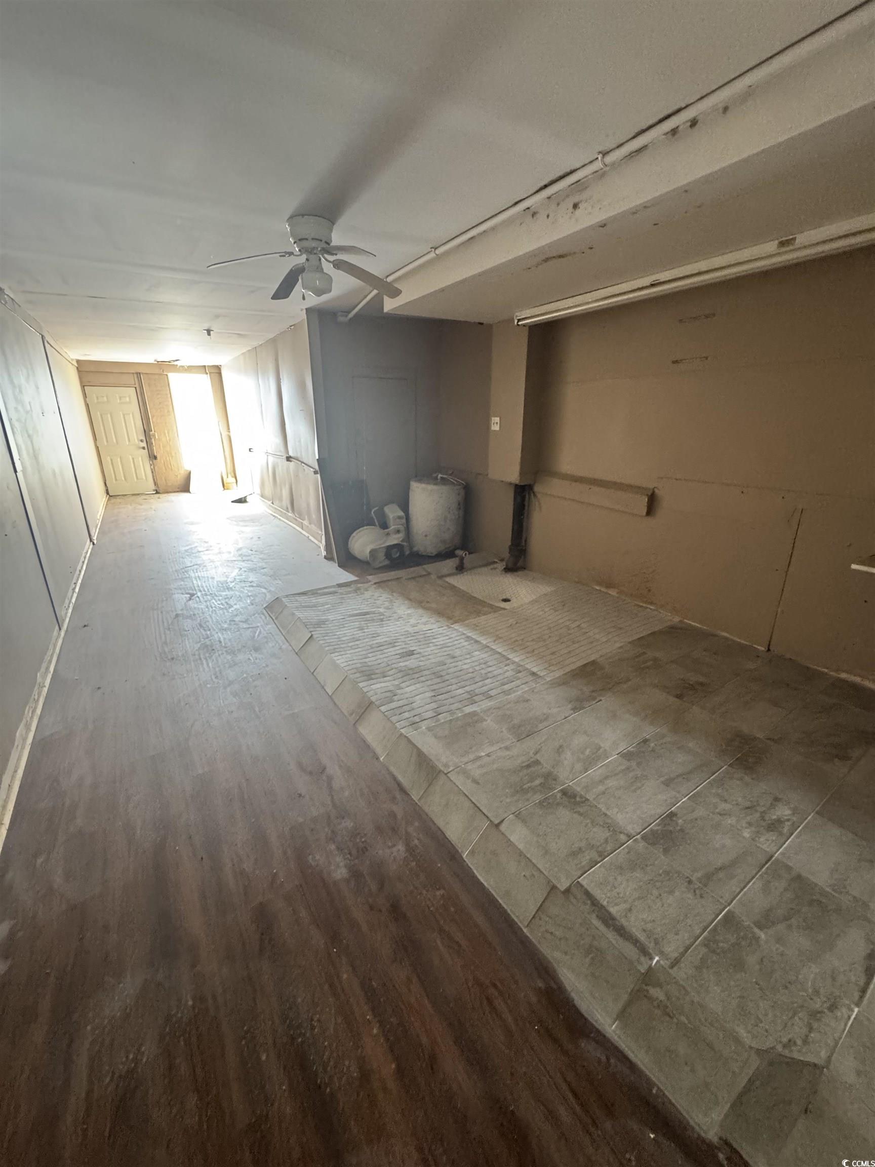 4211 Meeting Street Loris, SC 29569 - Photo 5 of 22 Unfurnished living room with a ceiling fan and wood finished floors