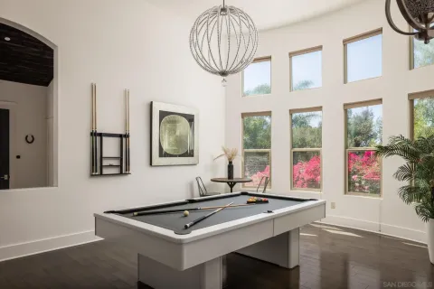 a room with furniture a window and a chandelier