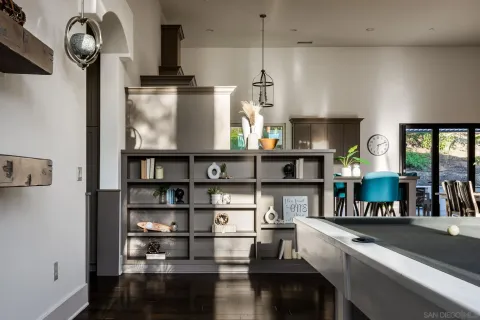 a kitchen with appliances cabinets and a table